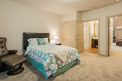 Cozy private bedroom with an attached bathroom