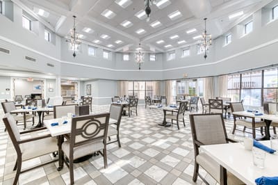 Bright dining room with tables and chairs arranged