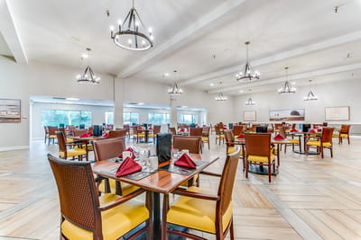 Dining room setup with elegant tables and decor