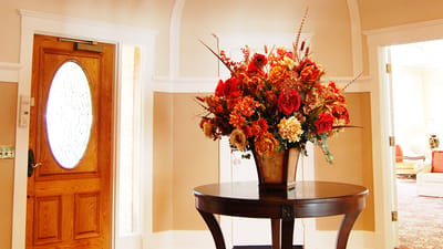 Elegant floral arrangement in a facility lobby.