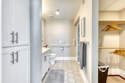 Modern bathroom with safety features and closet space