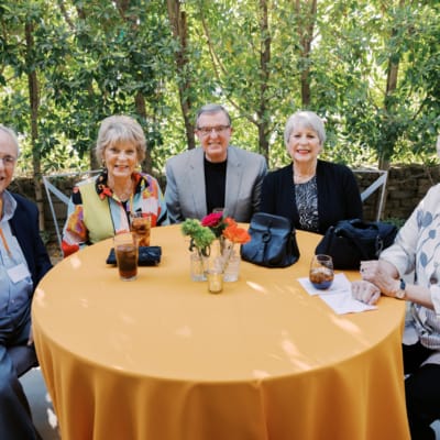 Residents enjoying a gathering at an outdoor table