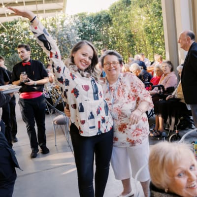 Residents enjoying a lively event with staff participation