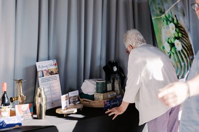 Resident interacting with a display table at an event