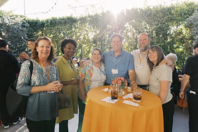 A group of residents mingling at an outdoor event