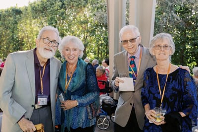 Four residents posing together at a social event