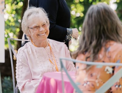 Happy resident enjoying conversation outdoors