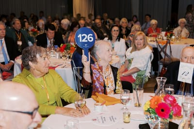 Residents participating in an event at a dining area