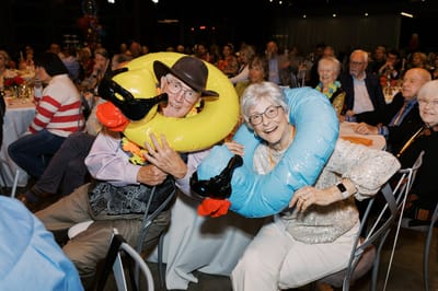 Residents enjoying a festive event with playful floaties