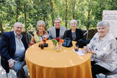 Residents enjoying a gathering at an outdoor table