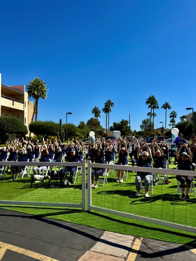 Residents participating in an outdoor exercise event