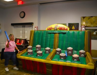 Resident participating in an activity with a game setup