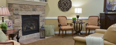 Cozy sitting area with fireplace and comfortable chairs