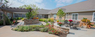Beautifully landscaped outdoor space with seating and flowers