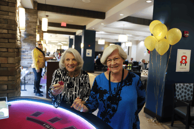 Residents enjoying a fun game in a common area