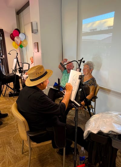 Residents enjoying an art activity in a community space