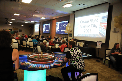 Residents enjoying a casino night event in the activity room