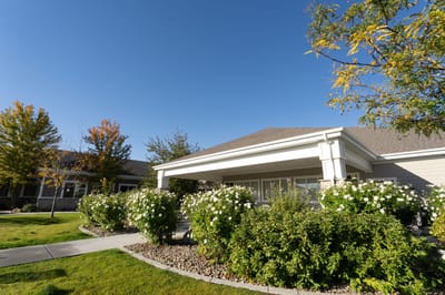 Exterior view of the facility surrounded by greenery.