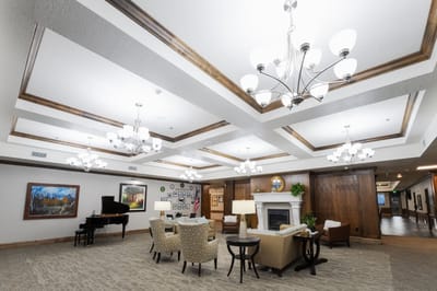 Spacious common area with seating and piano
