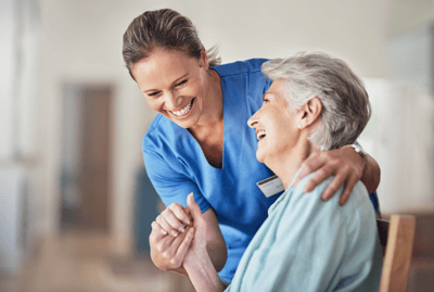 Caregiver interacting warmly with a resident