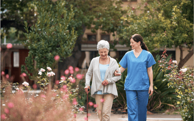 Caregiver assisting a resident in the garden