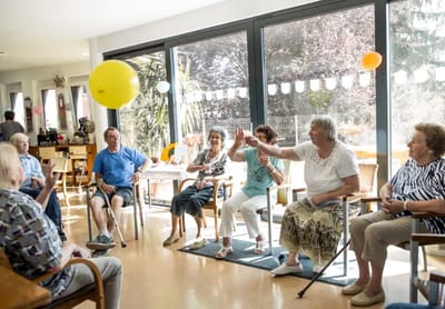 Residents enjoying an activity in a common area.