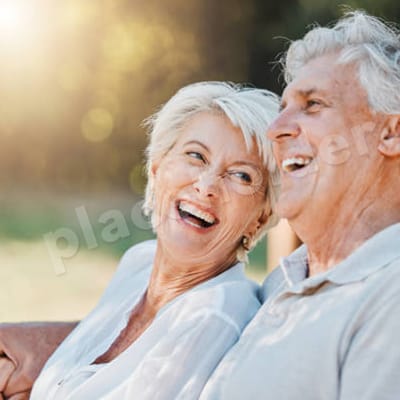 Senior couple enjoying a moment outdoors together.