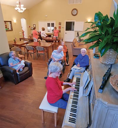 Residents enjoying music in a common area.