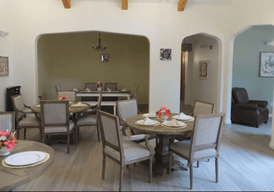 Dining area with tables and floral centerpieces