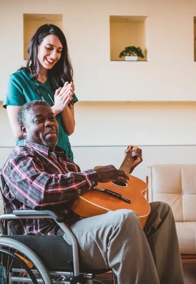 Staff and resident enjoying music together.