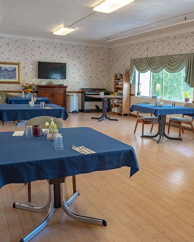 Dining room with tables set for meals