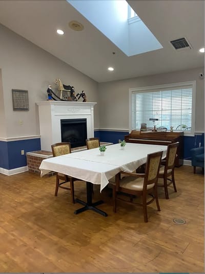 Bright dining area with a table set for residents