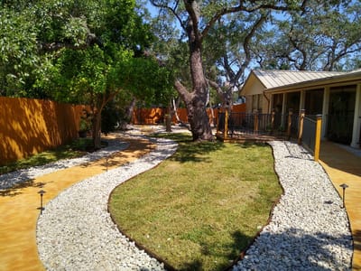 Pathway through landscaped garden at Red Oak Memory Care