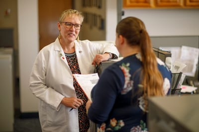 Staff member discussing information with a resident