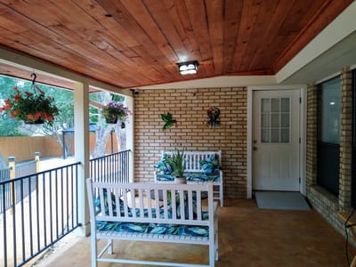 Outdoor patio area with seating and plants