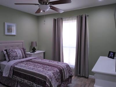 Cozy resident room with a bed and window