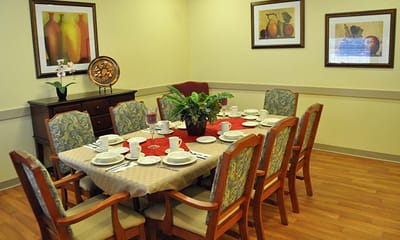 Dining room setup with plates and decorations