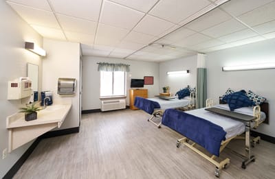 Bright and inviting shared resident room with two beds