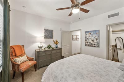 Cozy private room with decorative chair and lamp