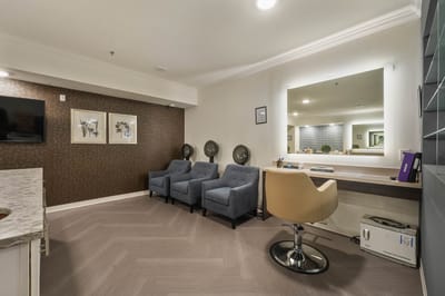 Interior lounge area with chairs and mirror