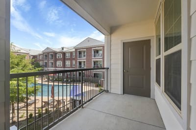 Balcony view overlooking the pool and courtyard area