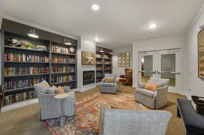 Cozy common area with bookshelves and seating