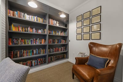 Cozy reading nook with bookshelves and armchair