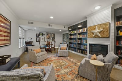 Cozy common area with seating and bookshelves