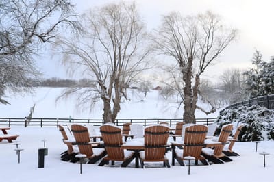 Outdoor seating area with chairs in a winter setting