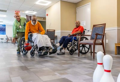 Residents playing a game of bowling in a common area