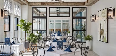 Elegant dining room with tables set for a meal