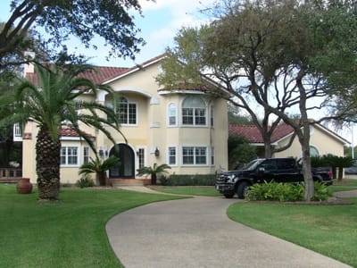 Exterior view of a senior living facility with landscaped grounds