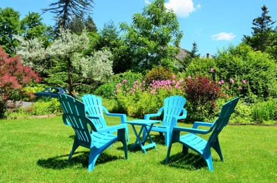 Colorful chairs in a garden setting
