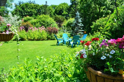 Bright garden area with chairs and flowers